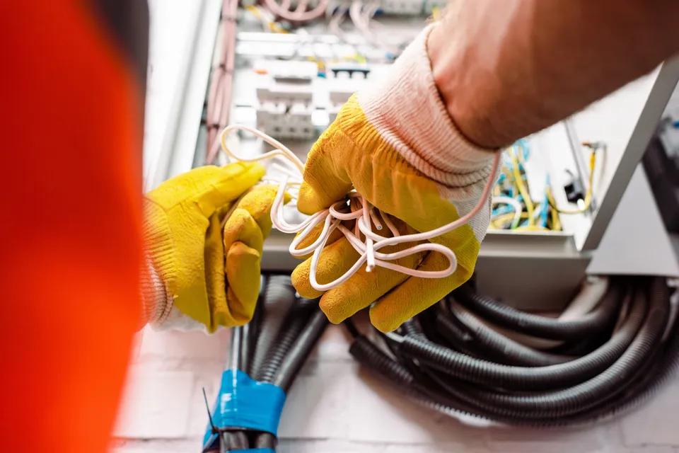 Licensed electrician performing home electrical repair in Cumberland RI