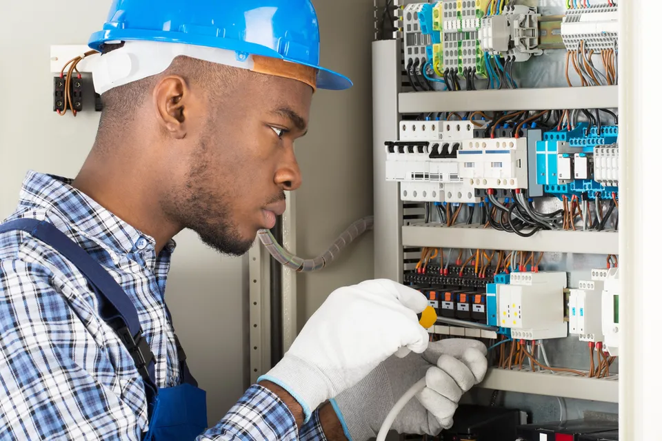 Electrician installing 200 amp electrical panel in Cumberland home